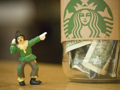 Scarecrow Pointing to Starbucks Money