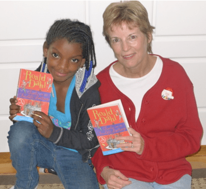 Summer Sauls and tutor Jill Wright, reading Roald Dahl’s Charlie and the Chocolate Factory